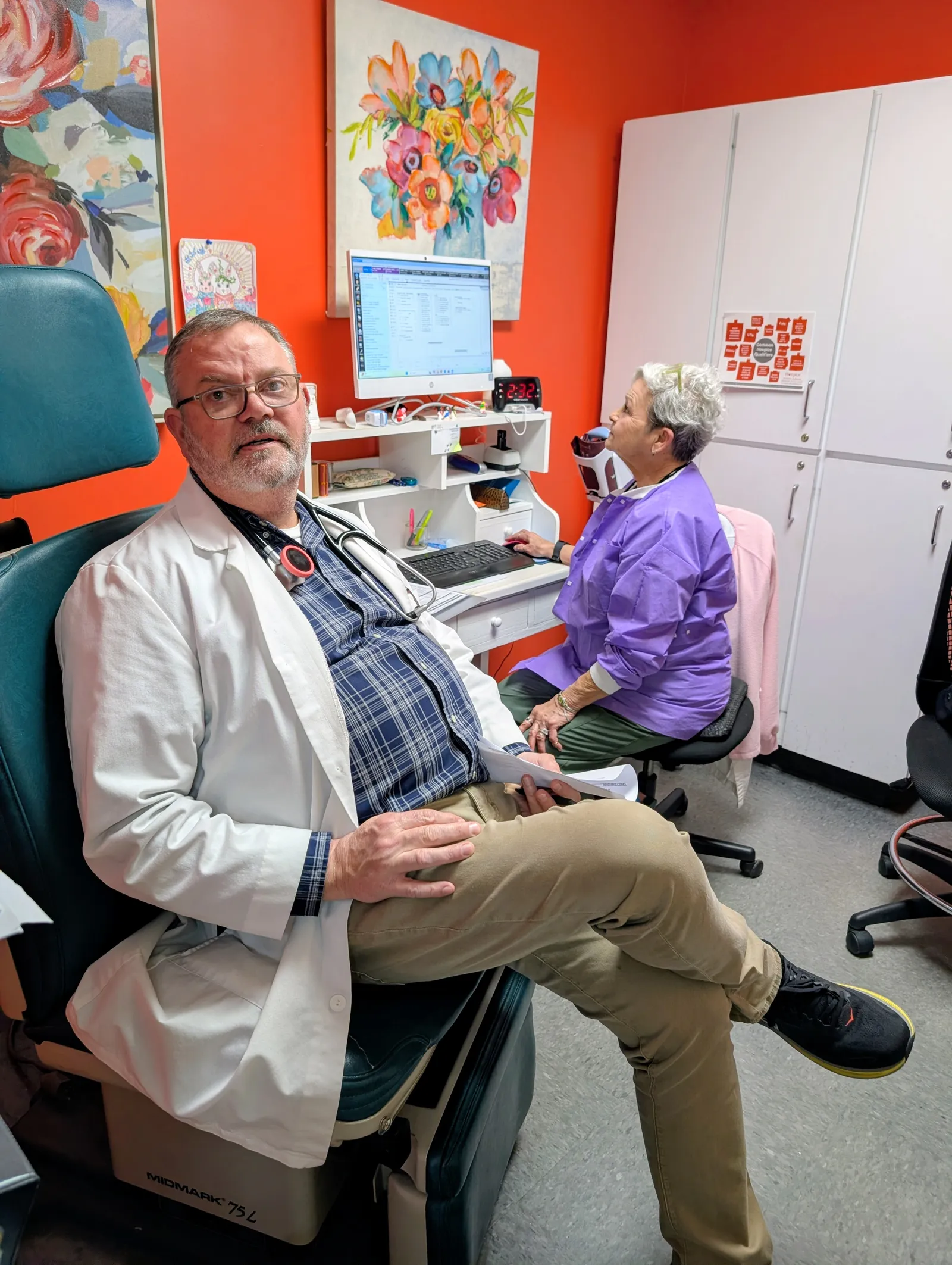 Physician consulting with patient during community encounter